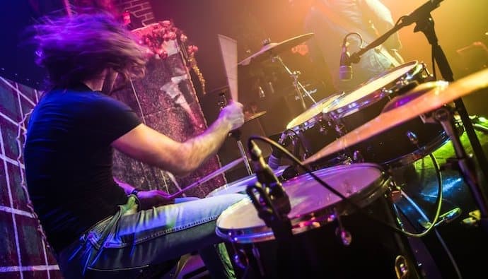 rock band drummer playing drums