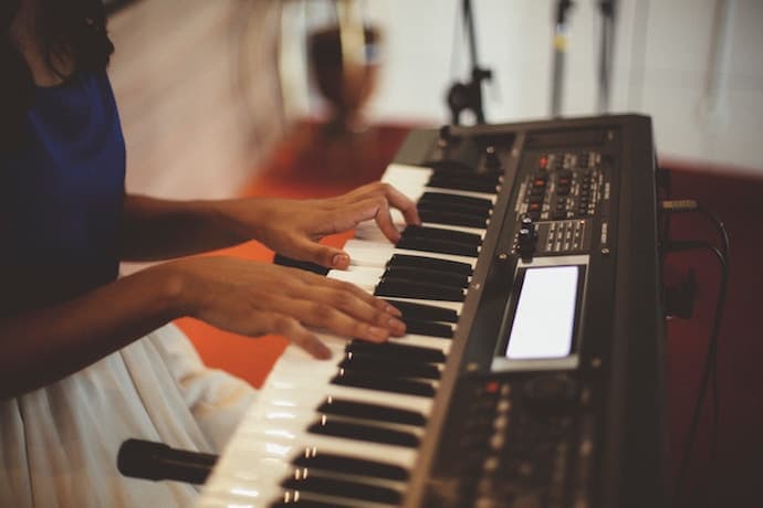 playing a digital keyboard with weighted keys