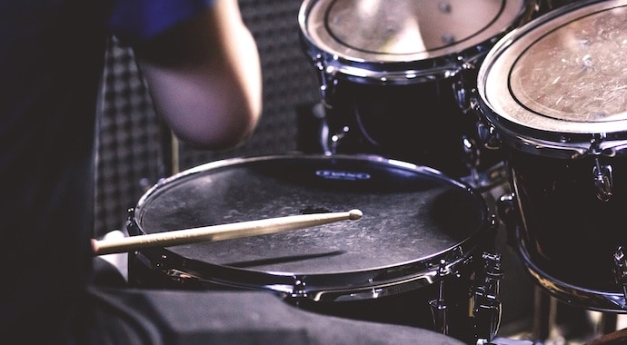 Drummer Playing in a Studio