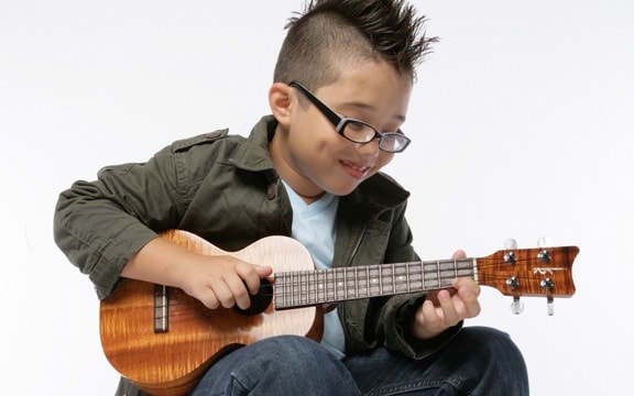 Kid Playing Ukulele