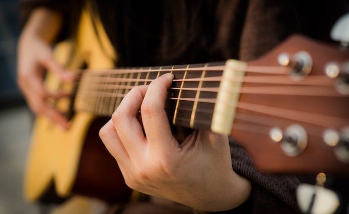 Playing a High End Acoustic Guitar