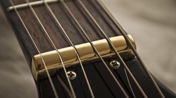Preventing String Muting with Wide Neck Acoustic Guitars